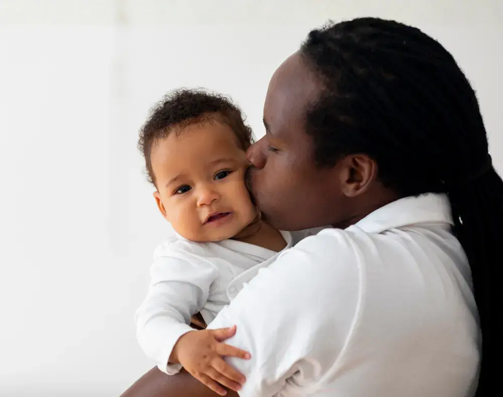 a man cuddles his baby